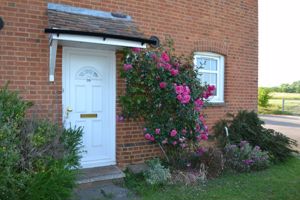Roses around the front door- click for photo gallery